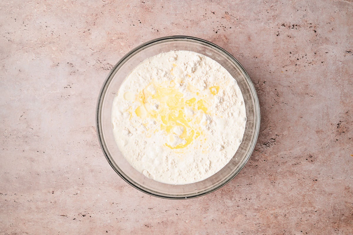 Pancake batter mixed together in a glass bowl.