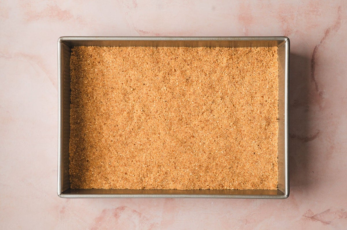 Graham cracker crust in a pan.