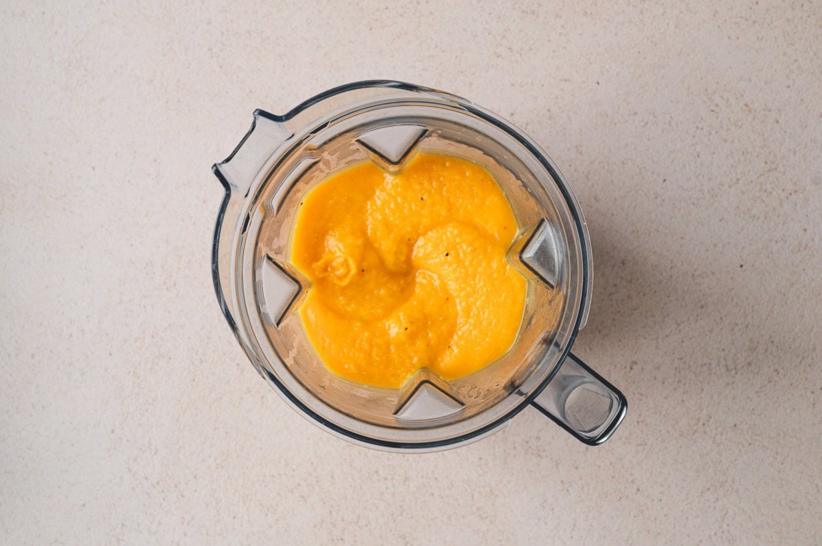 orange butternut squash sauce in a blender