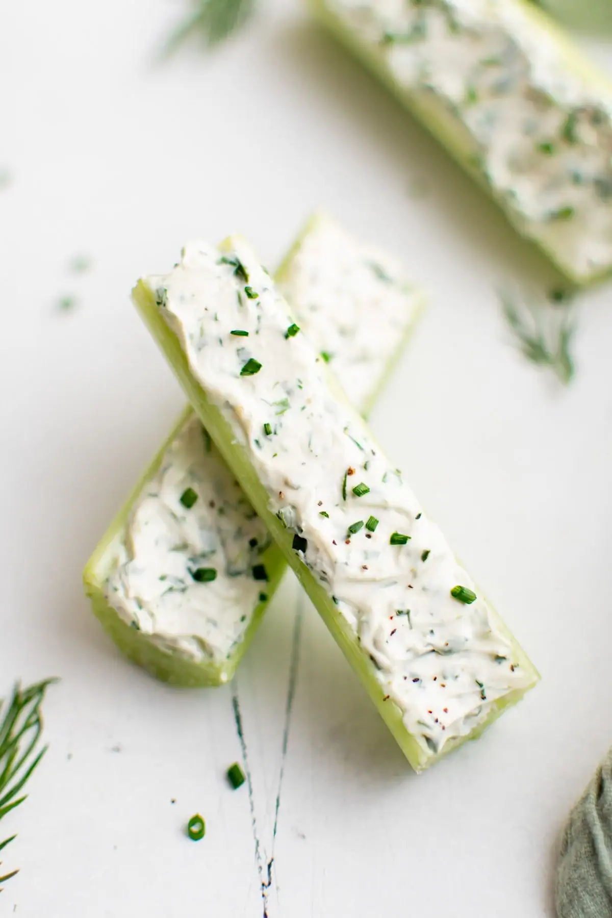 Celery sticks with herb cream cheese.