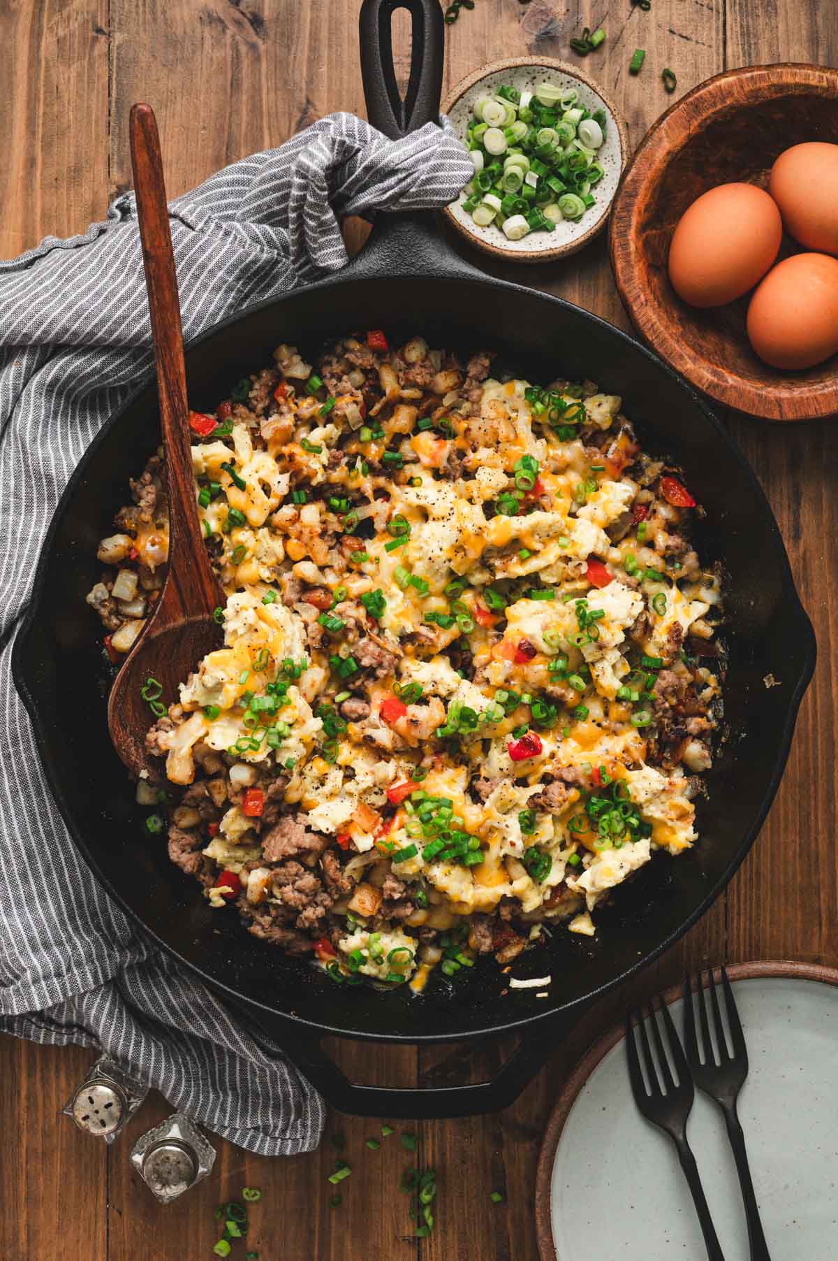 Cooked breakfast hash in a cast iron pan.