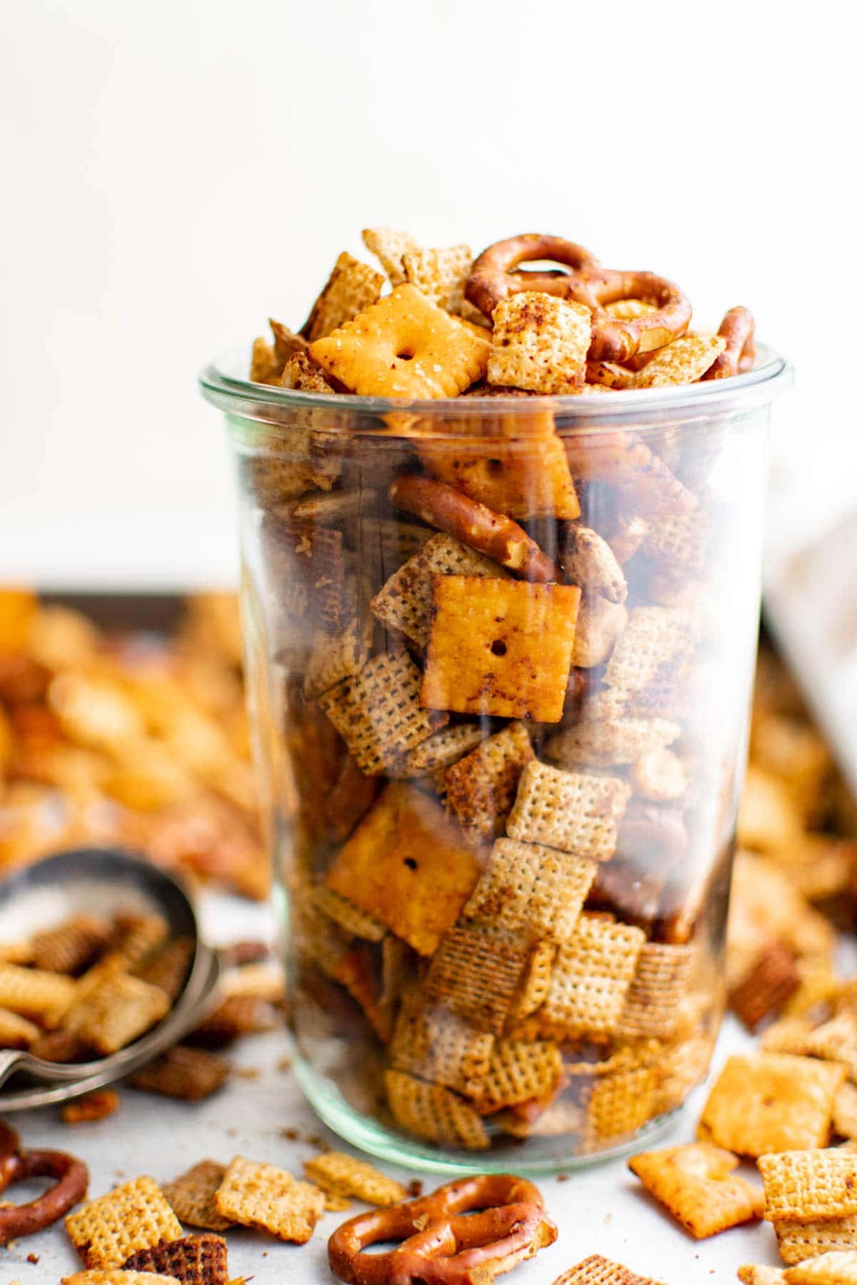 spicy chex mix in a tall glass