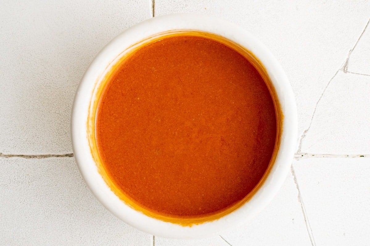 sauce for spicy chex mix combined in a bowl