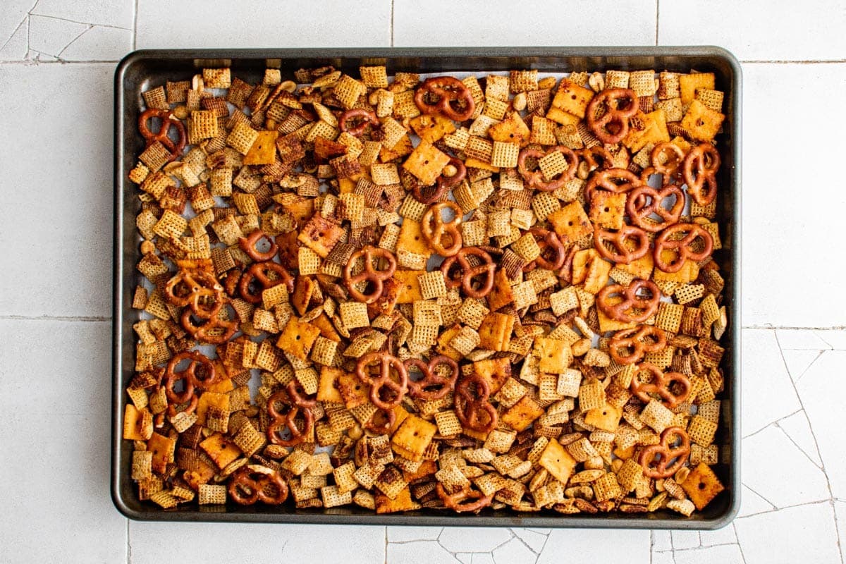 baked spicy chex mix on baking sheet