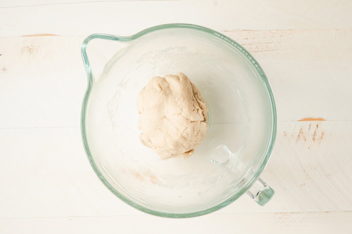 Star bread dough in a glass bowl.