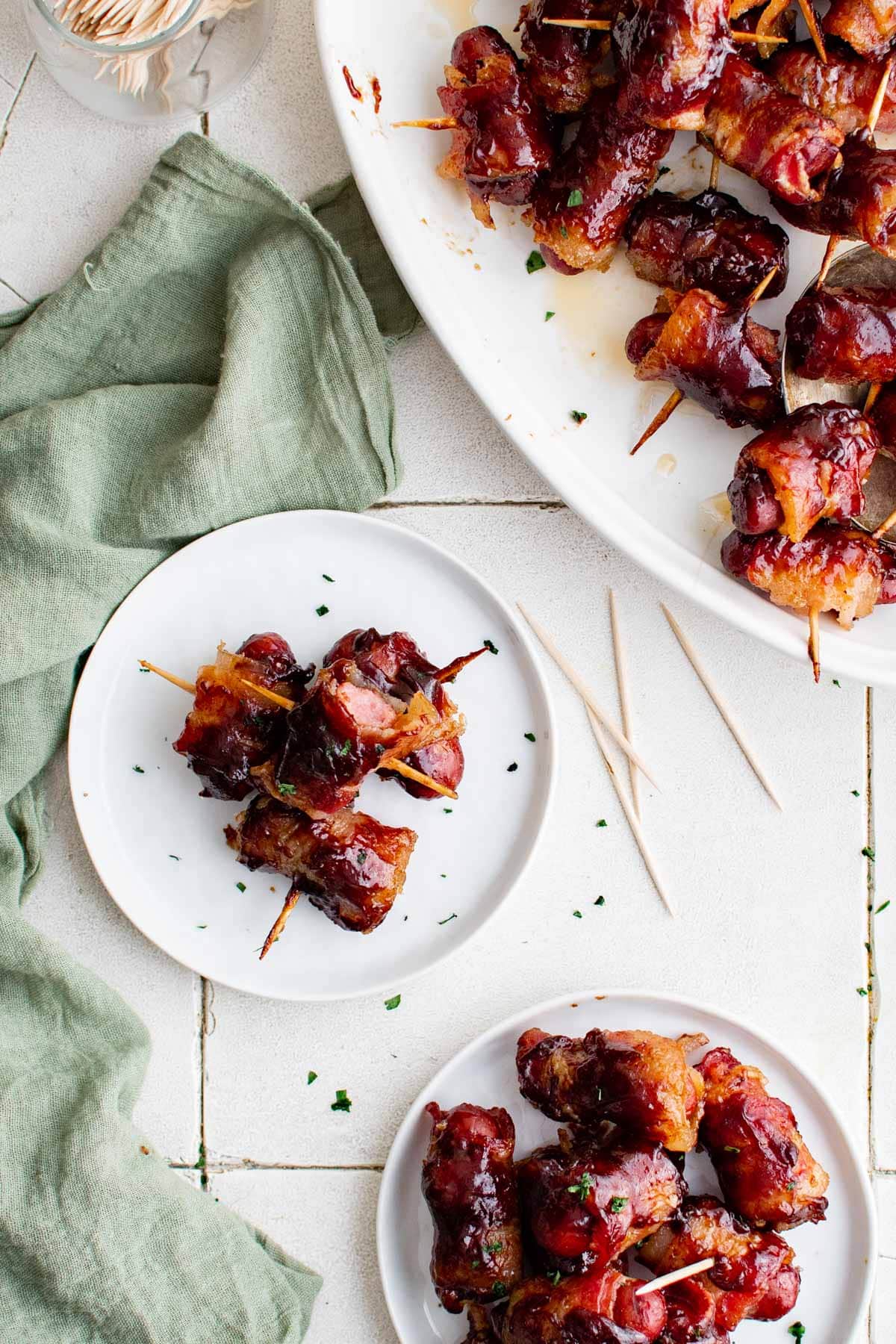 smokies sausages with bacon on white plates