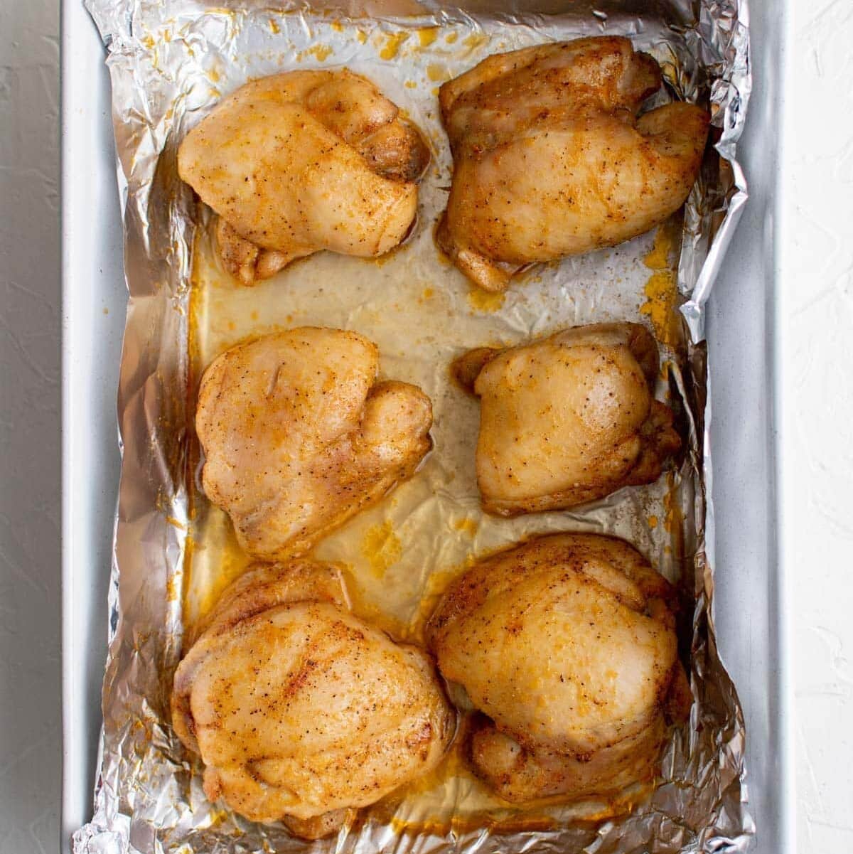 roasted chicken thighs bakeng dish with foil