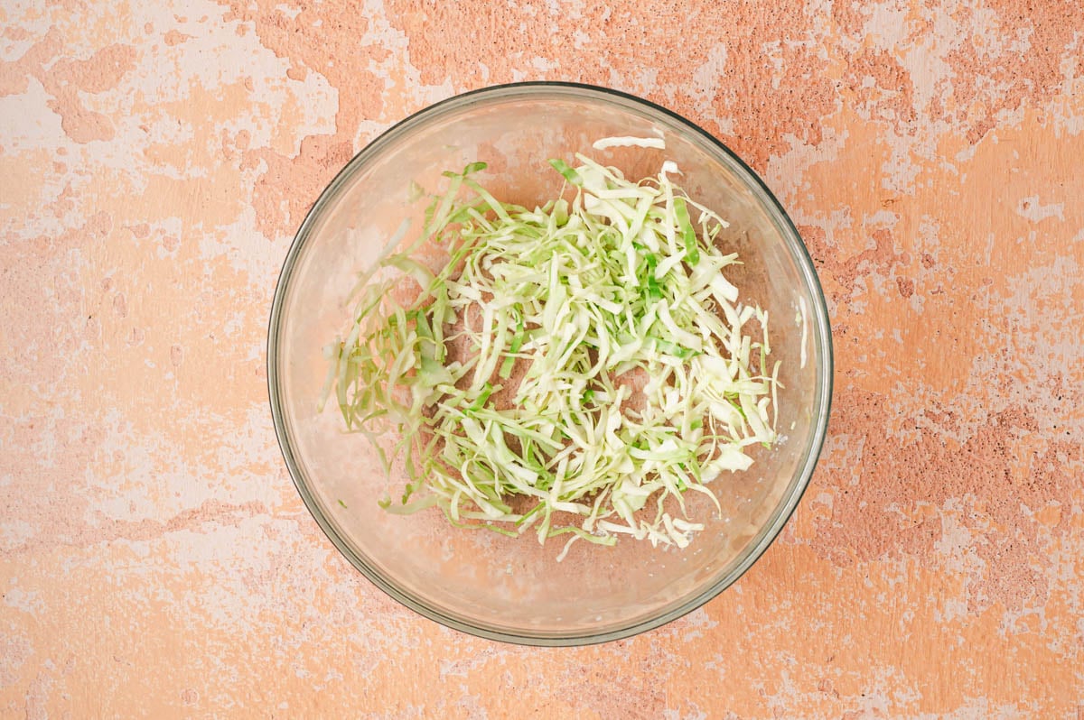 Shredded cabbage in a glass bowl