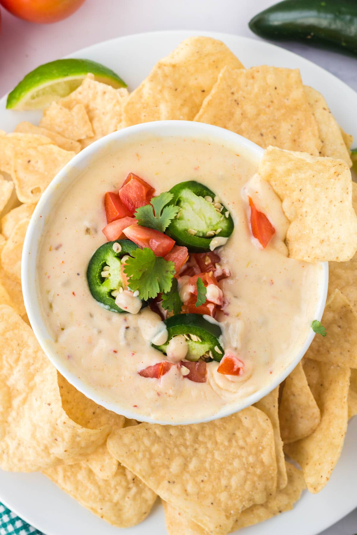 queso blanco in a white dish, platter with tortilla chips