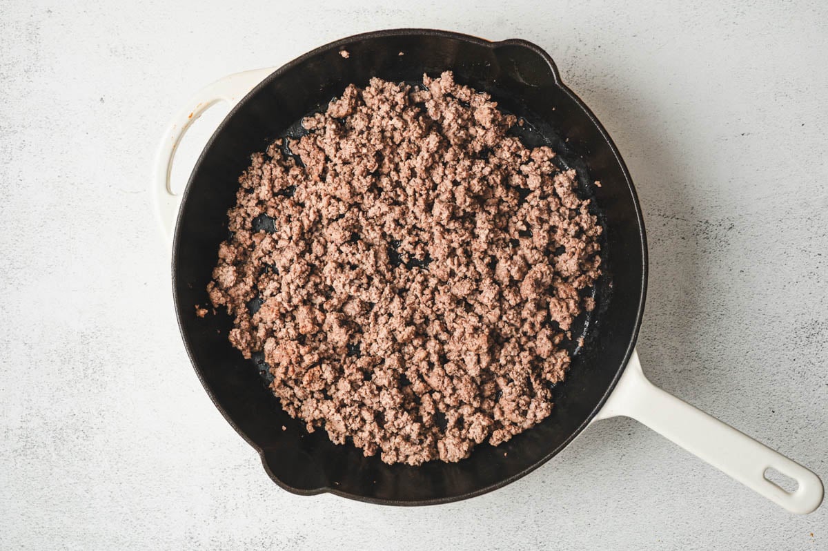 Ground beef cooked in a skillet.
