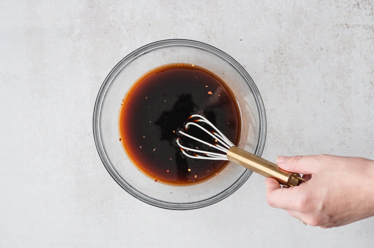 Bourbon soy sauce in a glass bowl.