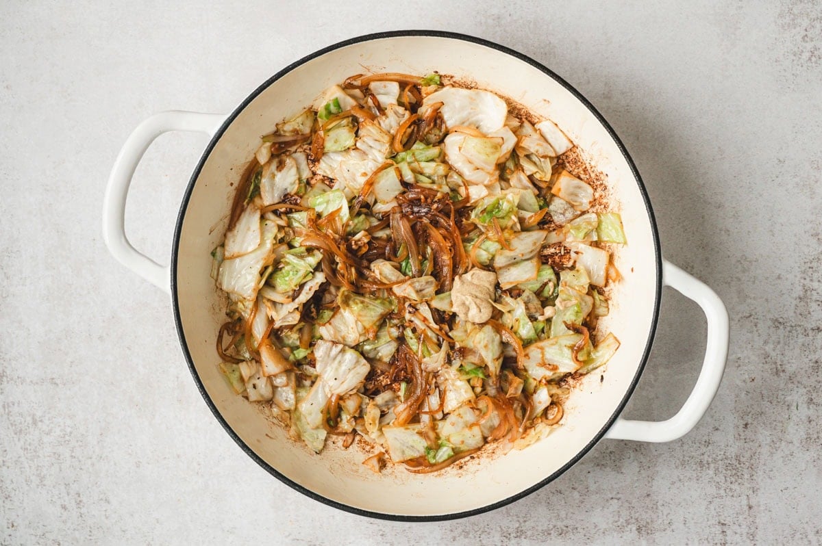 Sauteed cabbage and onions in a skillet