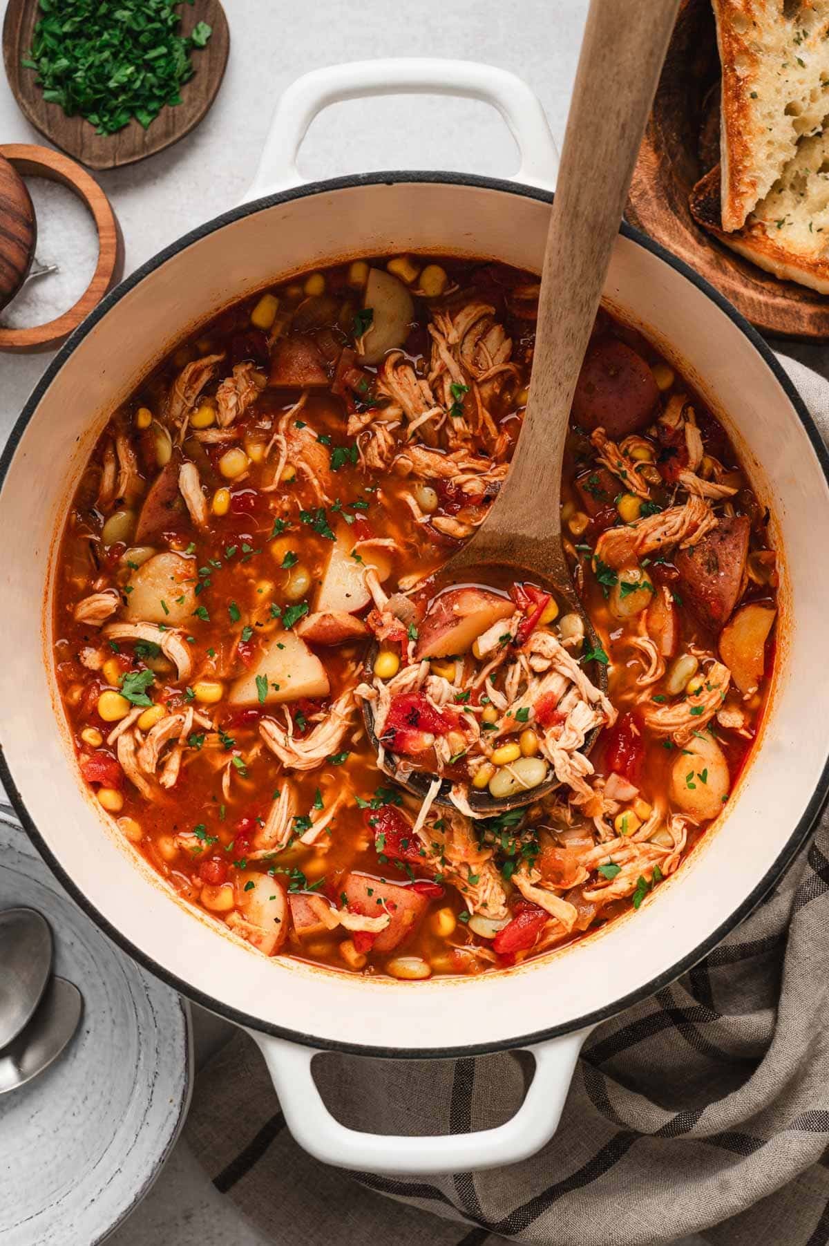Brunswick stew in a large white pot.
