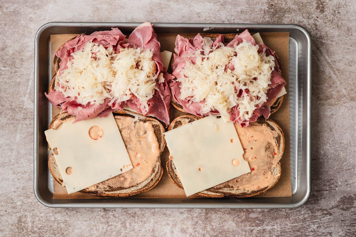 Open faced Reuben sandwich loaded with corned beef and sauerkraut
