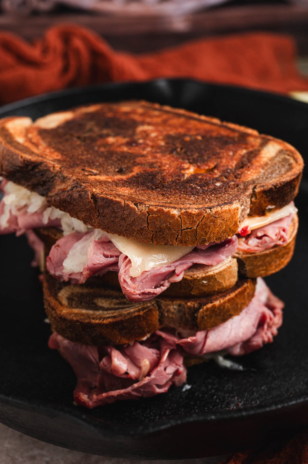 Reuben sandwiches stacked on top of each other