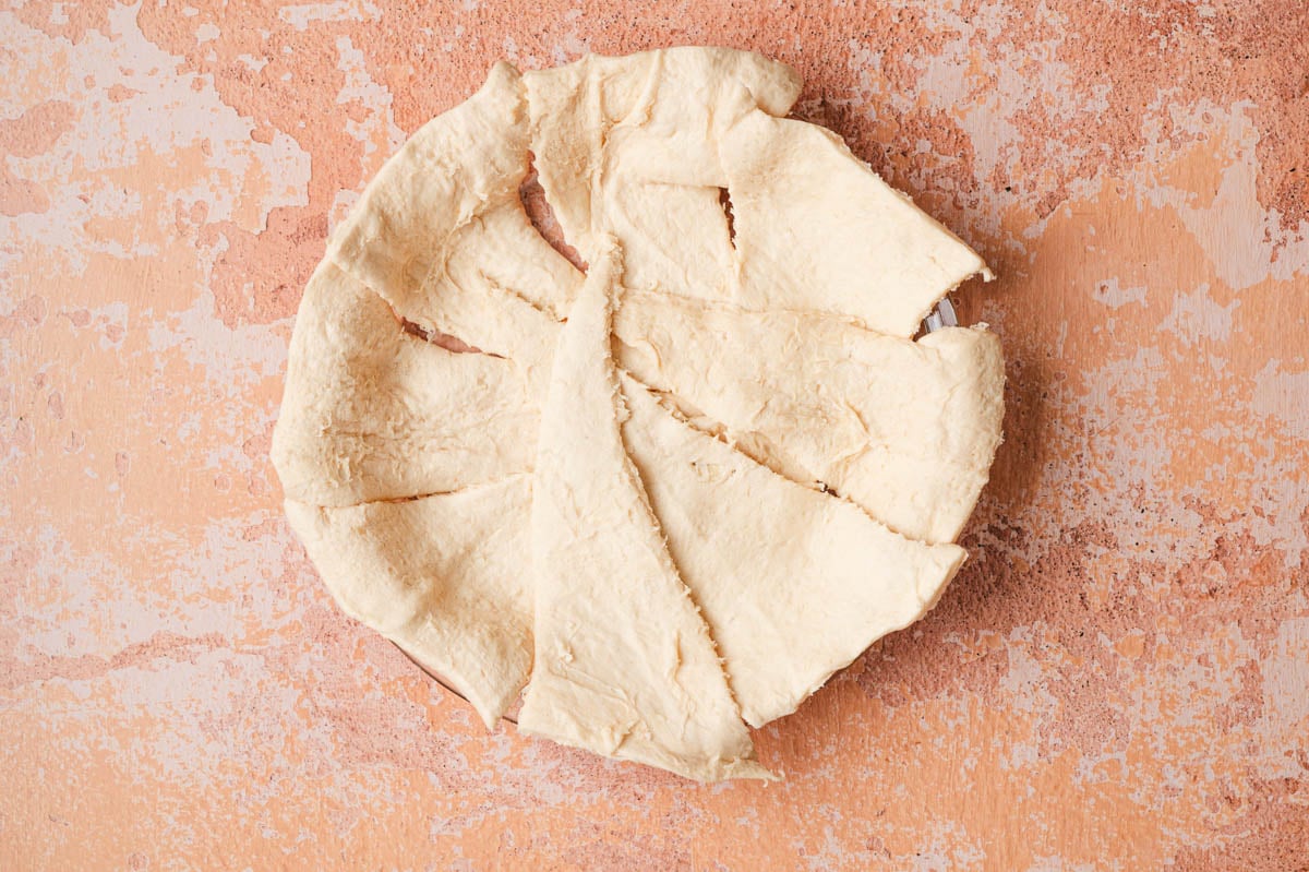 Photo of crescent rolls in a pie dish.