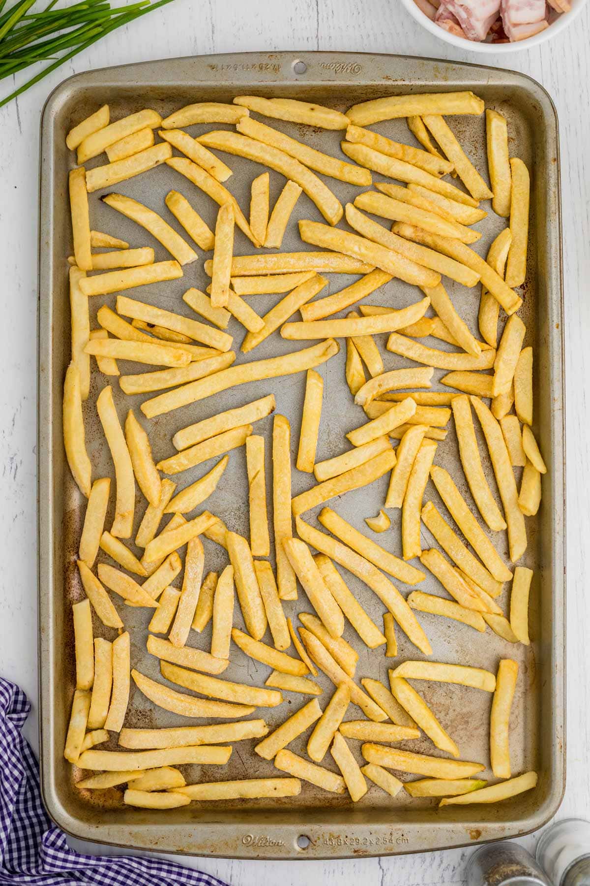 Frozen french fries on a baking sheet
