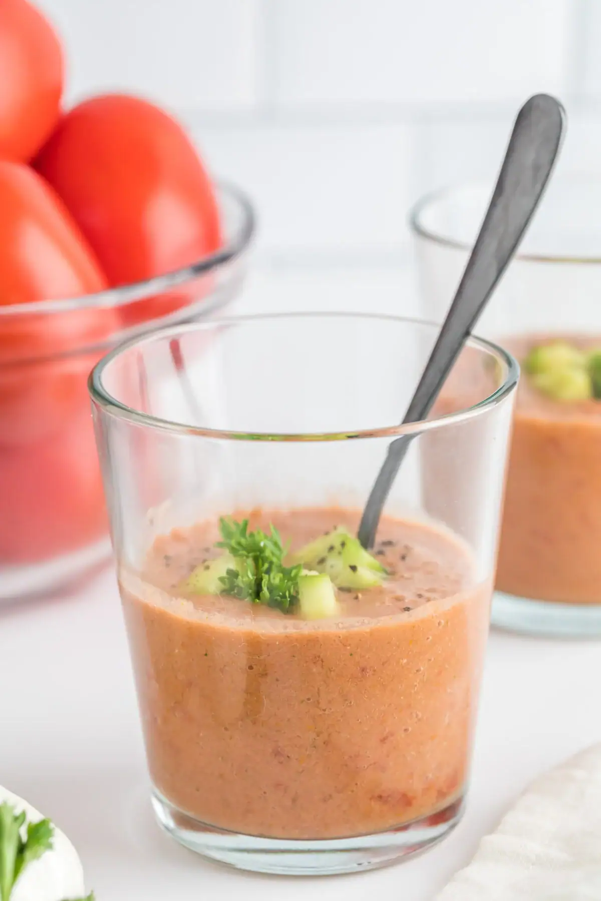glass of gazpacho soup with a spoon