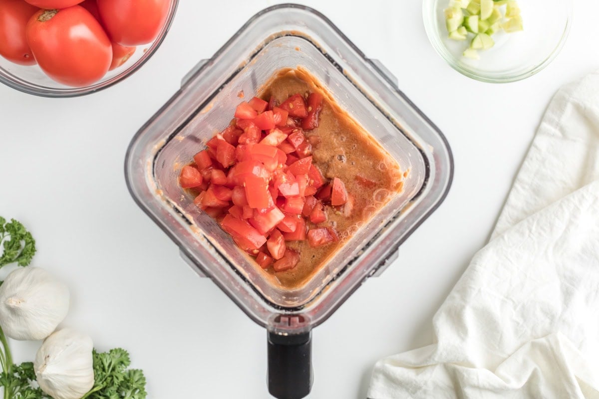Gazpacho in a blender with diced tomatoes