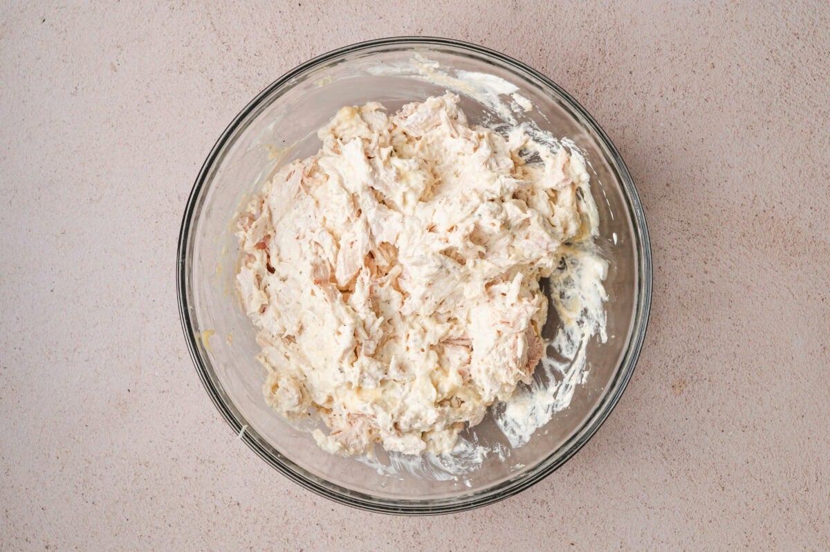 Creamy chicken filling in a glass bowl.
