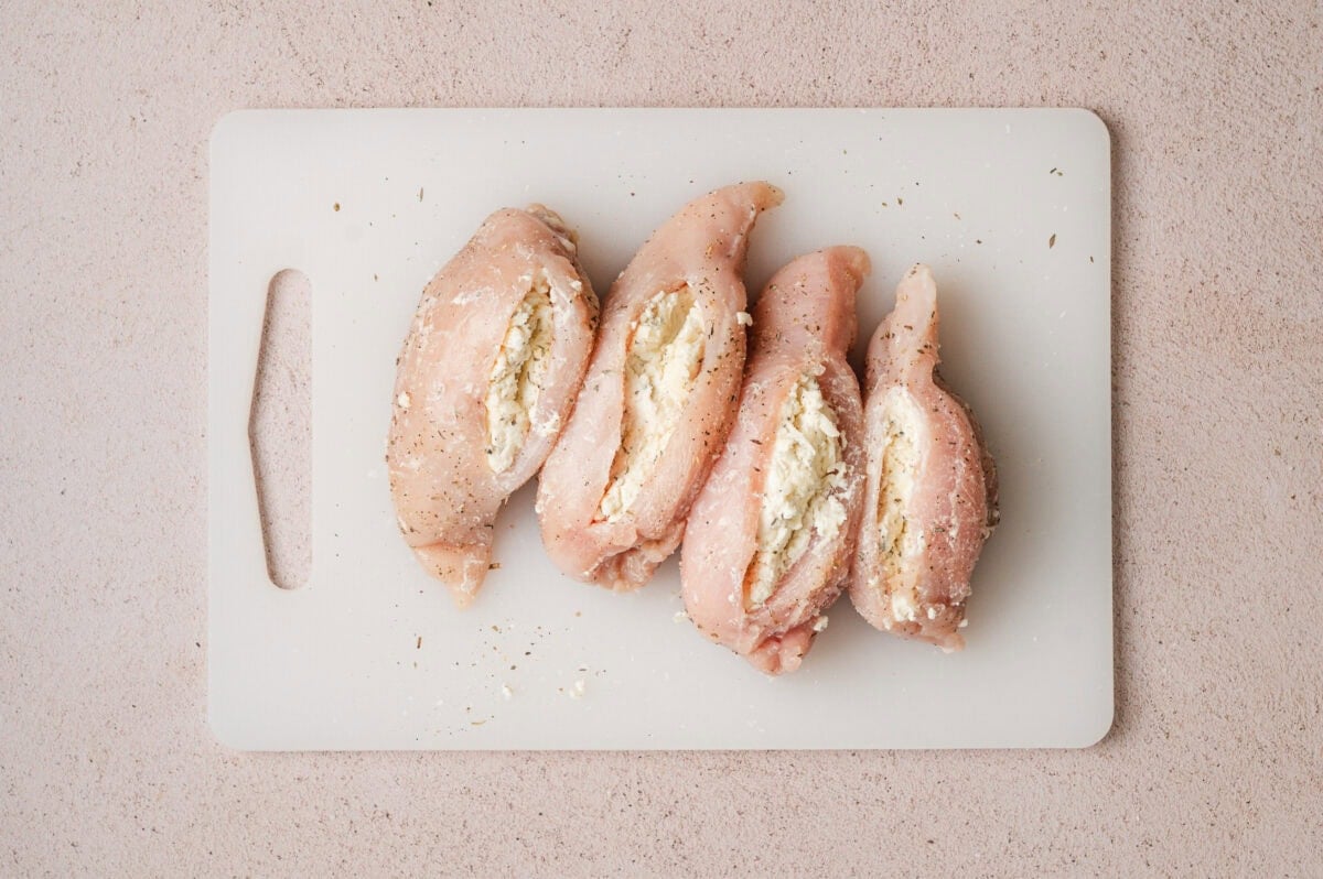 Raw chicken breasts stuffed with Boursin cheese.