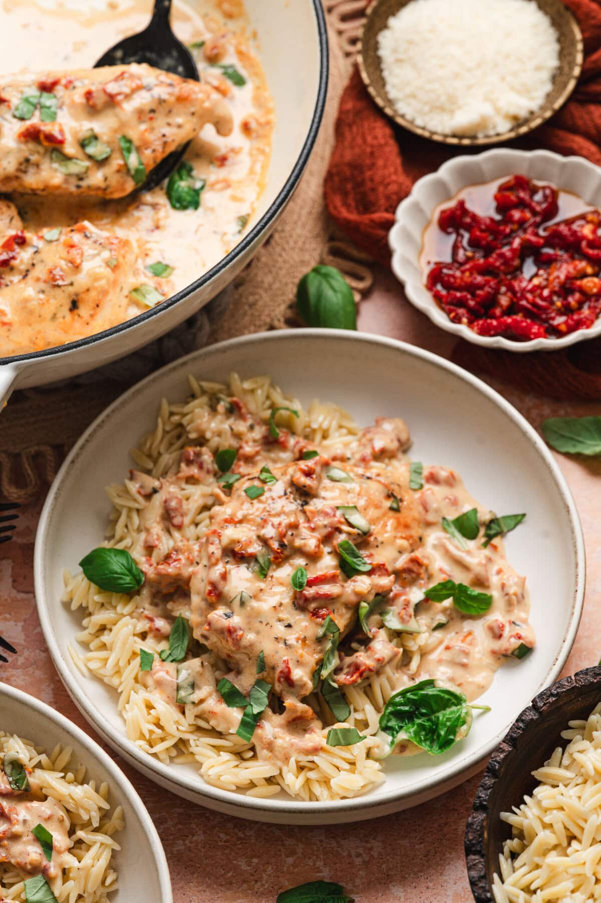 Marry me chicken over orzo in a dish.