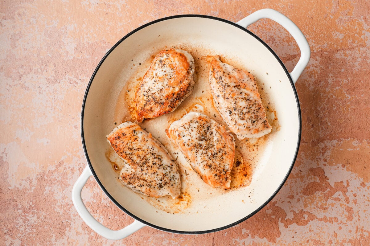 Seared chicken breasts in a pan