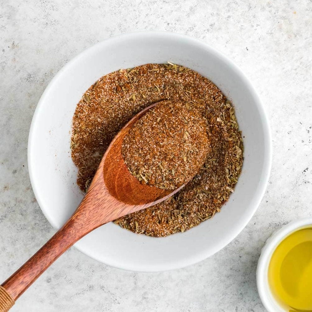 Cajun seasoning in a white bowl.