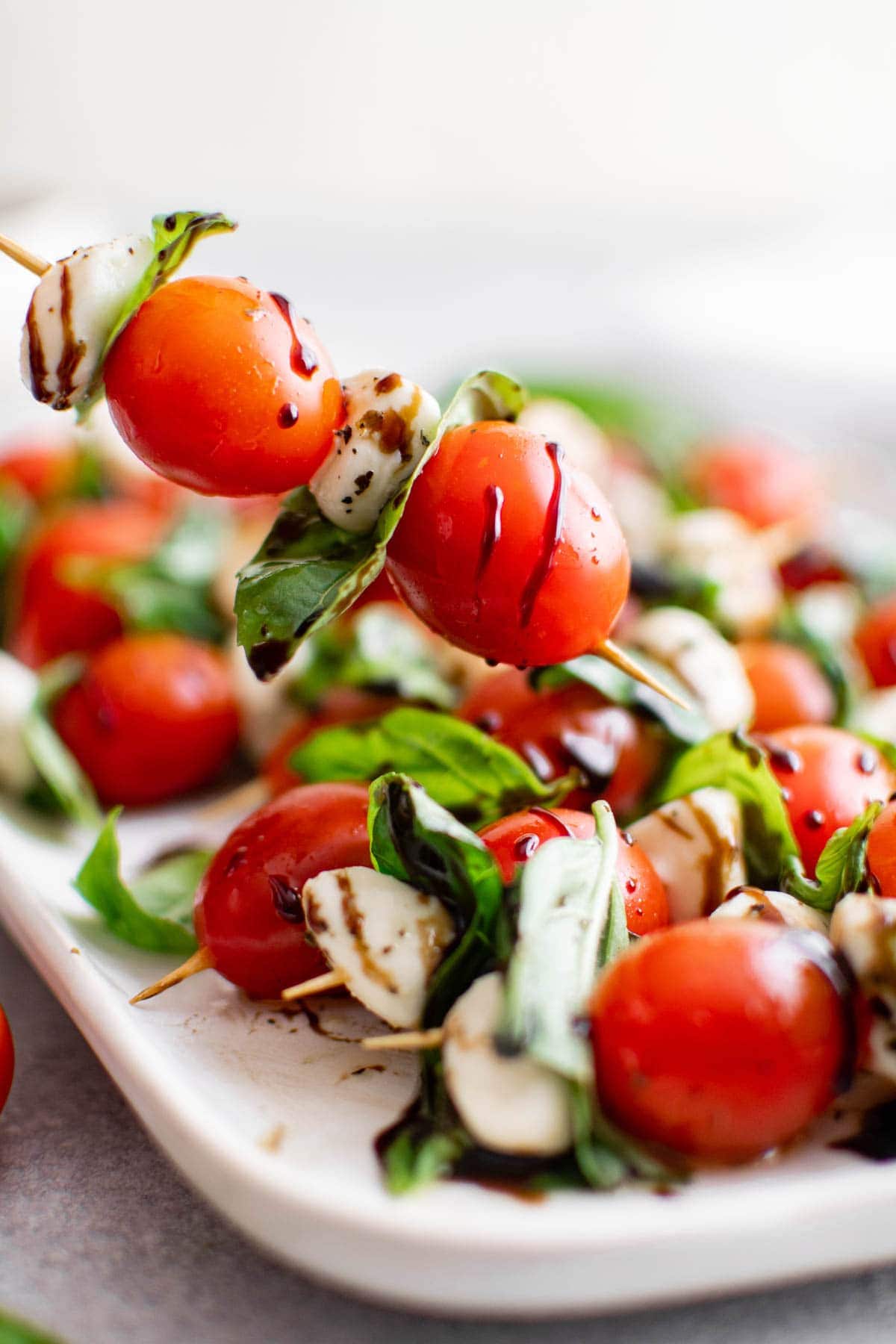 Caprese skewers drizzled with balsamic glaze