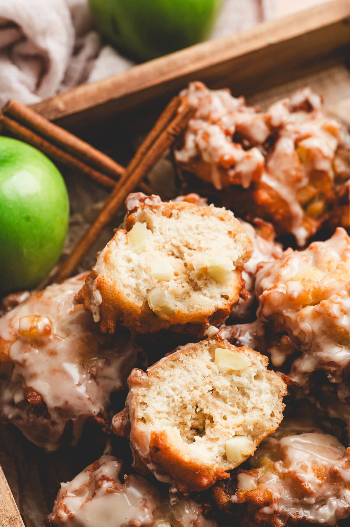 inside of an apple fritter showing fluffy texture and apple chunks
