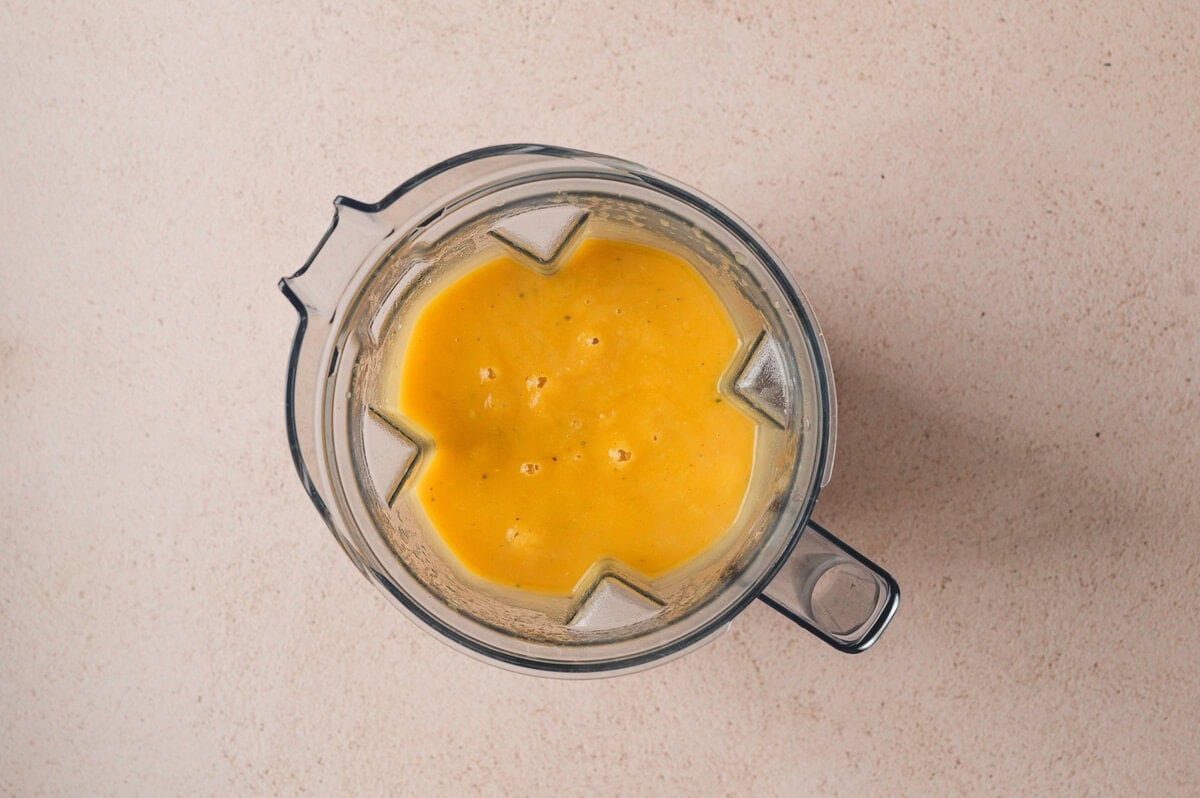 Blended butternut squash soup in a blender