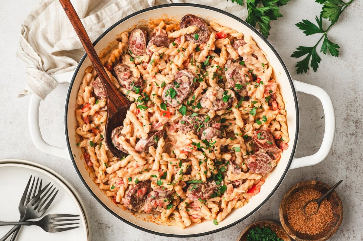 Cooked cajun sausage pasta in a pan